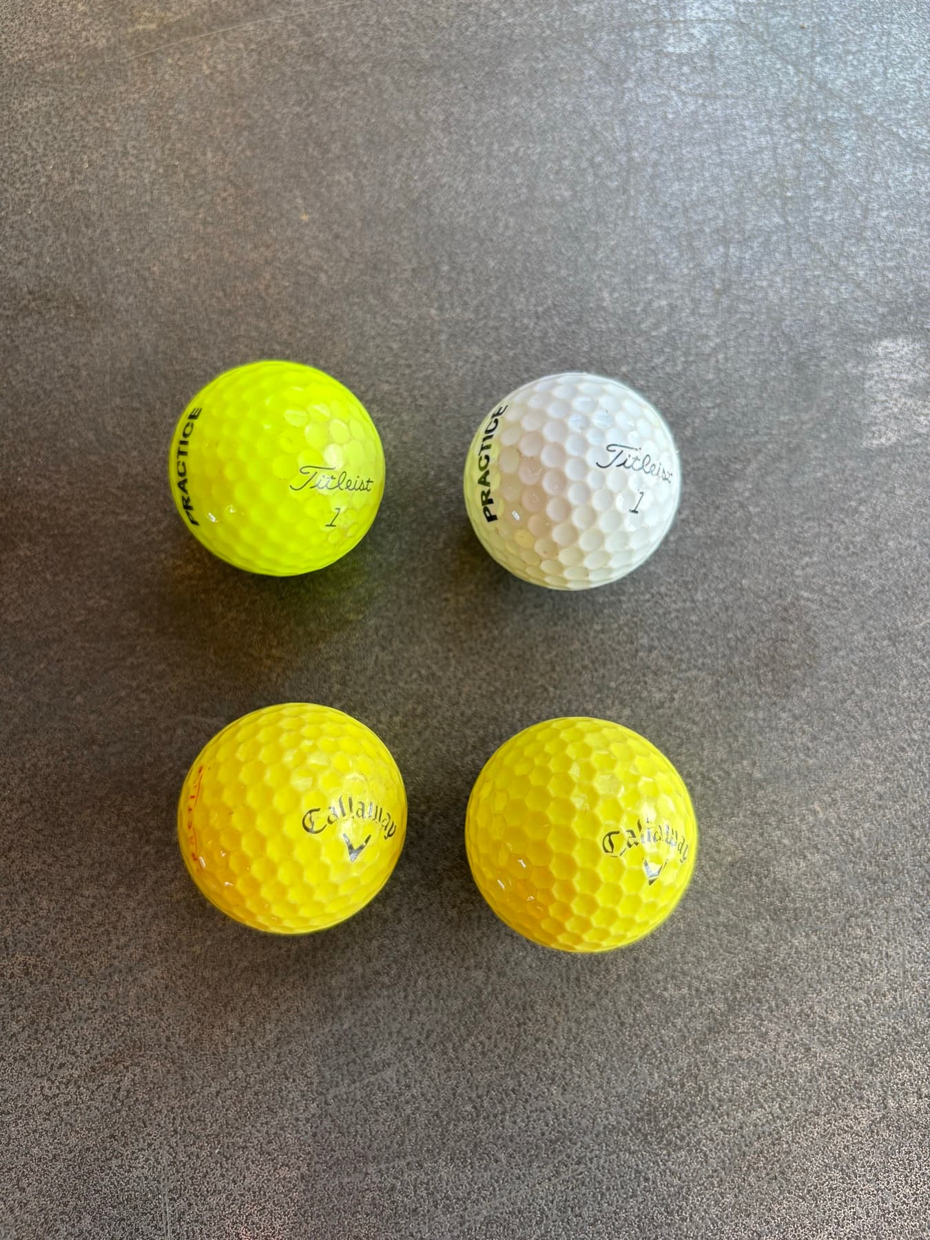 Titleist and Callaway golf balls at Big Moose Driving Range